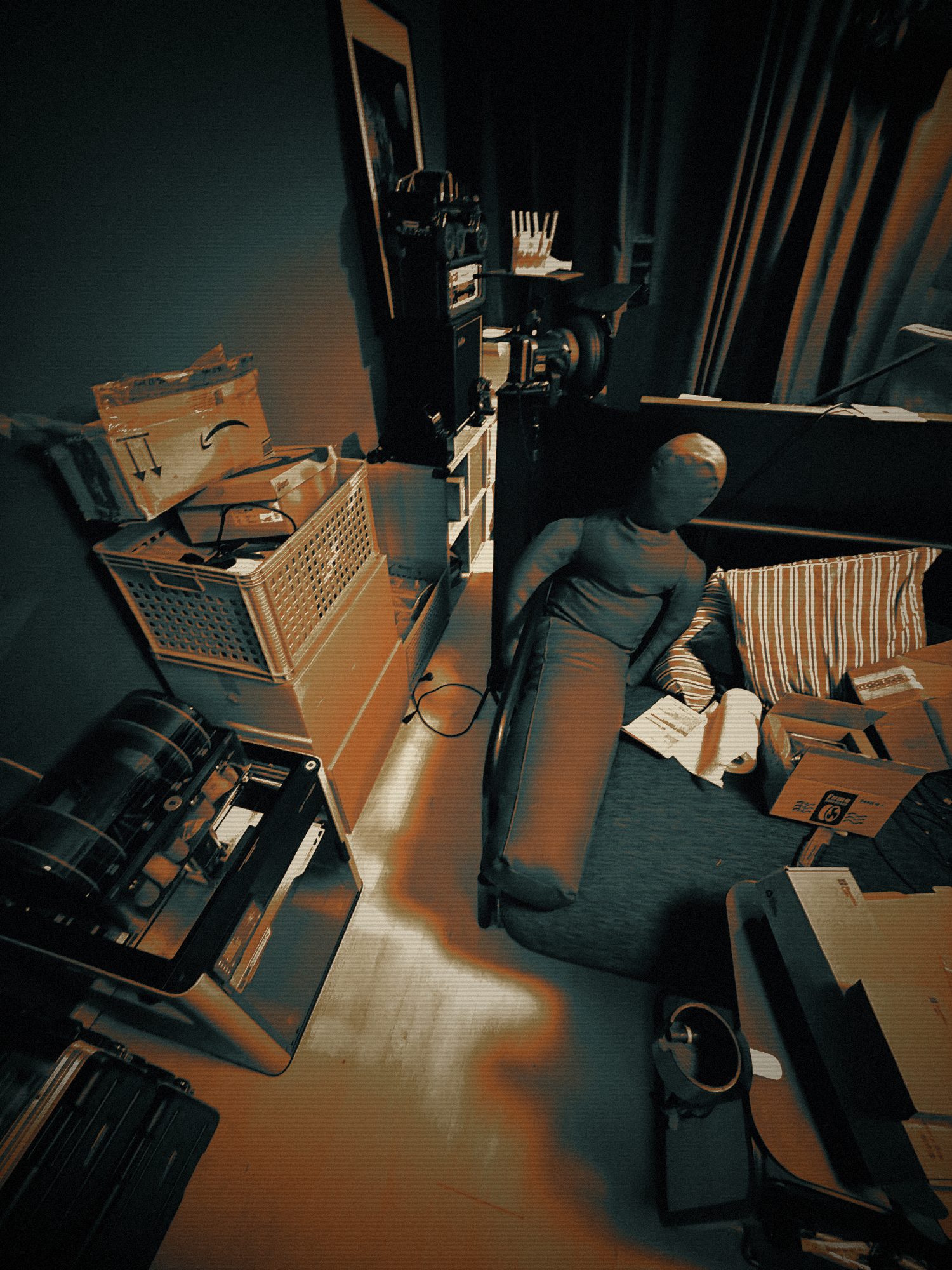 surveillance still — a faceless figure in the workshop
